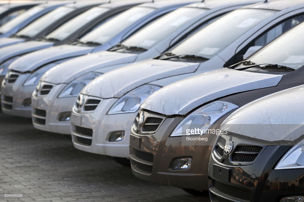 FAW V2 vehicles sit parked at the assembly plant of Al-Haj FAW Motors in Karachi. Photographer: Asim Hafeez/Bloomberg