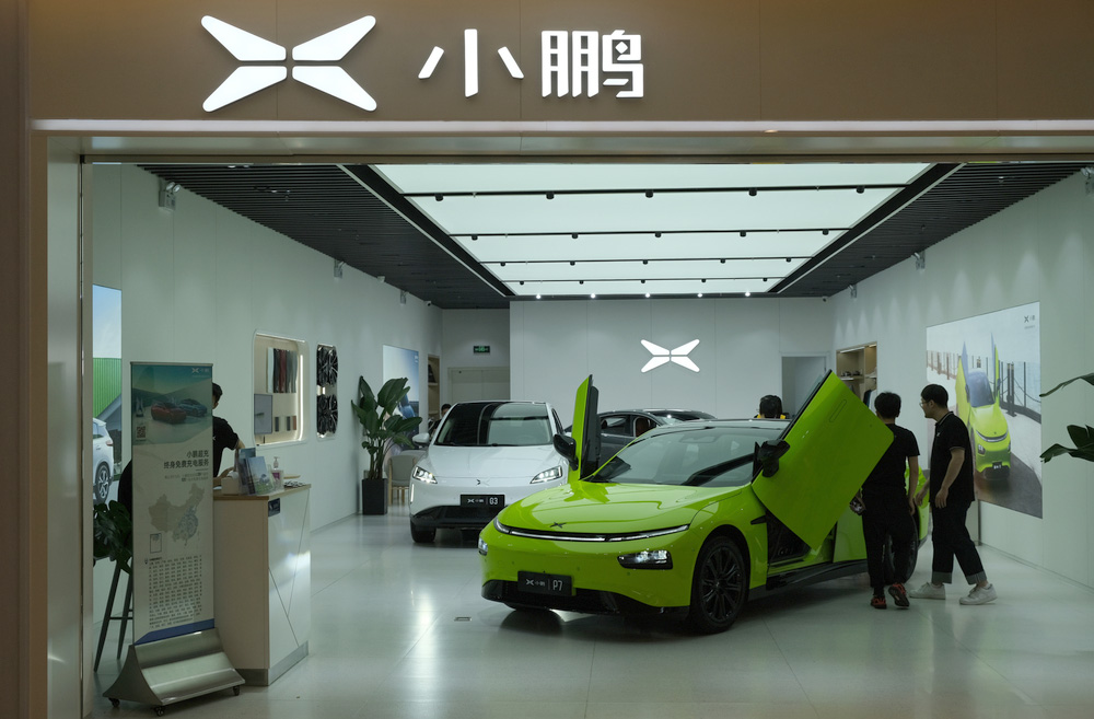 Shanghai.china july.2021:,Xpeng,Electric,Car,Store,With,Customers,Inside.,Xpeng,Motors