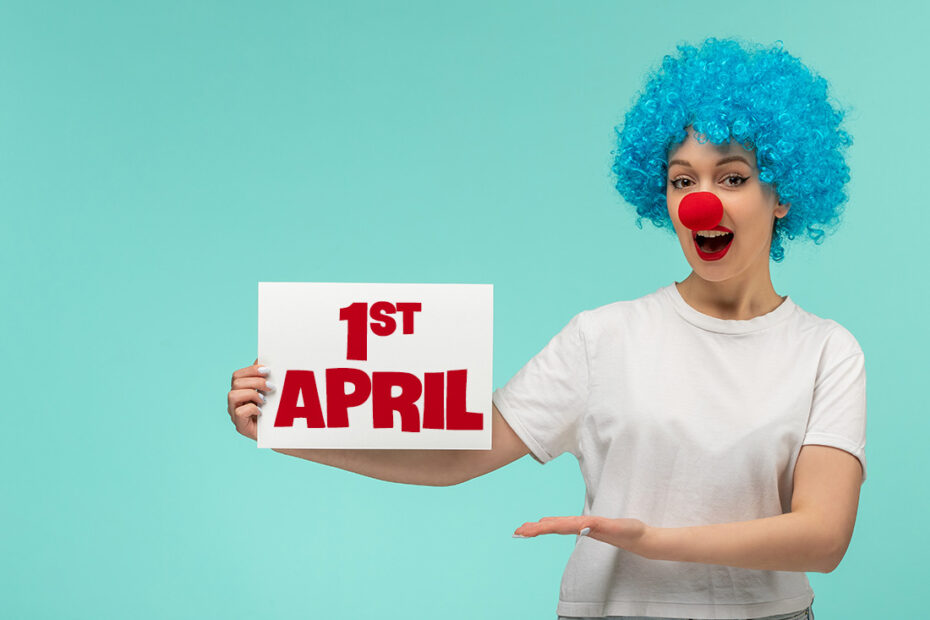 april fools day excited girl holding presenting paper with red nose clown costume blue hair
