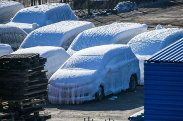 Frozen Ship Delivers Ice-Covered Cars to Russia Port in Frigid Cold 5