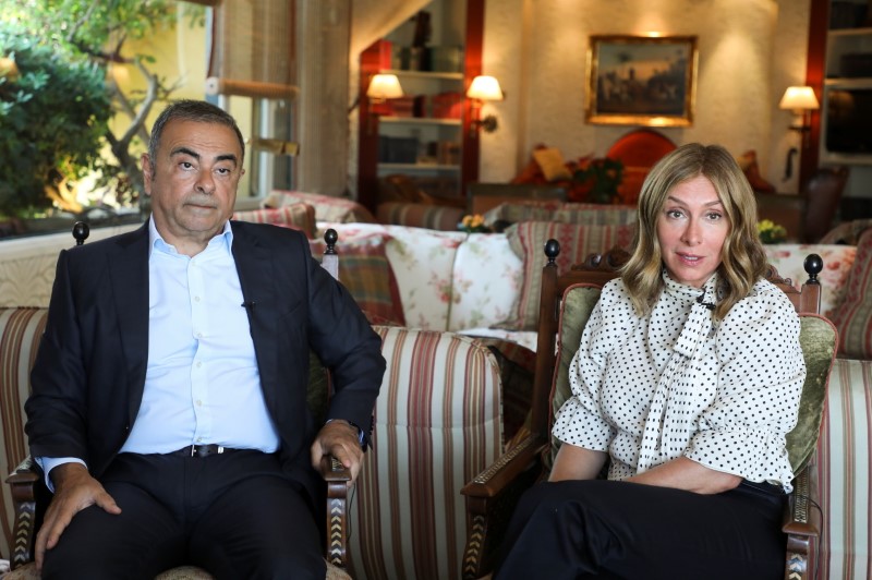Fugitive former car executive Carlos Ghosn, and his wife Carole Ghosn, talk during an interview with Reuters in Beirut